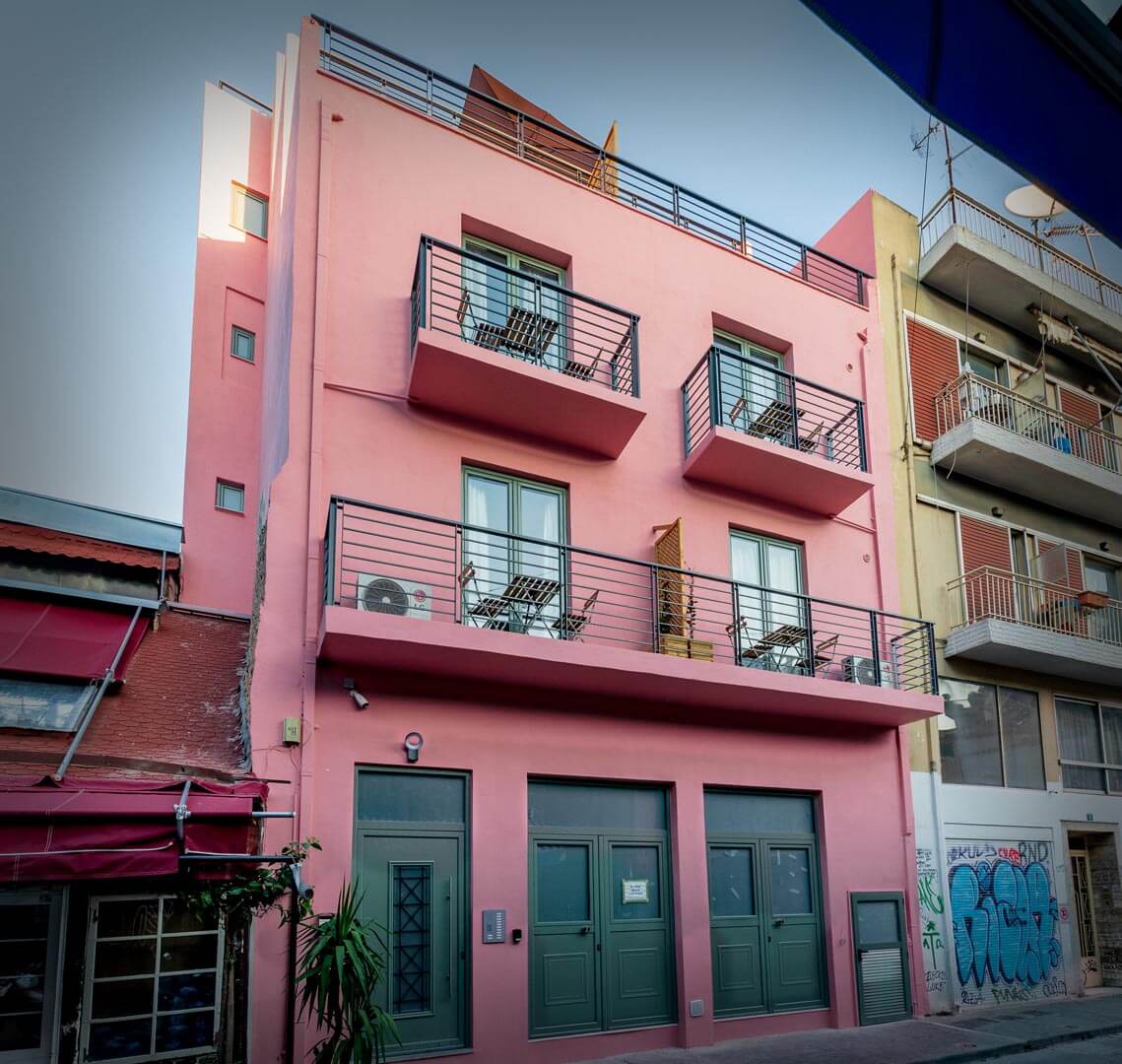 athens pink building central stay